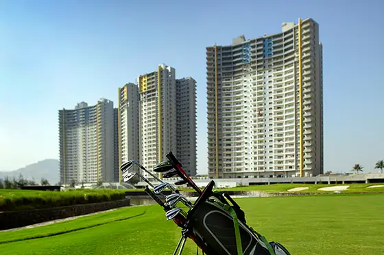 Golf tee with a Blue Ridge Hinjewadi tower behind